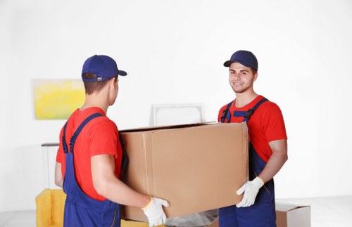 Professional removalists handling household items in Wimbledon