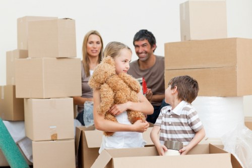 Professional movers loading items into a moving truck for storage
